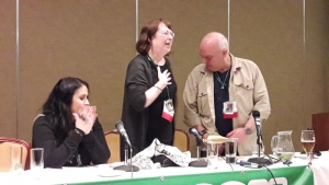 GoHs Diane Duane & Peter Morwood rendered speechless as they recieved the Golden Blaster film award for career achievement, as GoH Rhianna Pratchett applauds!